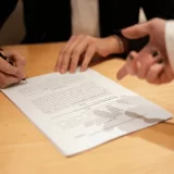 An attorney signs a document